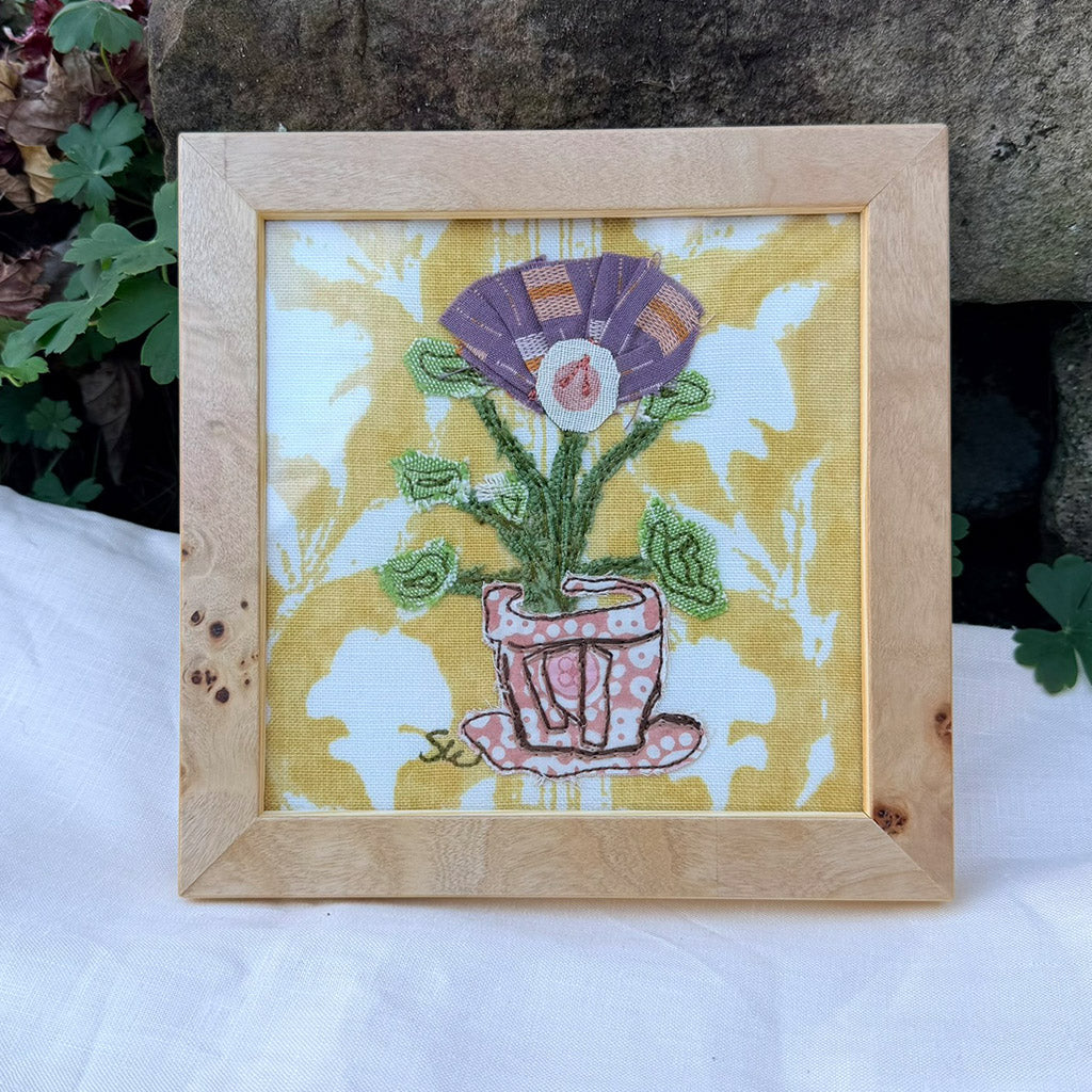 Mini Purple flower on yellow